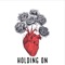 Holding On (feat. Mishaal) - Zaini lyrics