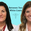 Between Two White Coats artwork