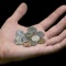 Am I Rich is a reference to determine if you are, in fact, rich, by helping you check the change in your pocket for the elusive $100,000 penny or million-dollar dime