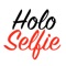 Holoselfie™ is an augmented reality app where you can record a holographic selfie video and then superimpose it onto real world objects or other people's faces