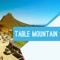 Table Mountain is a flat-topped mountain forming a prominent landmark overlooking the city of Cape Town in South Africa, and is featured in the Flag of Cape Town and other local government insignia