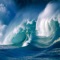 Watch a great and agitated Ocean with giant blue ocean waves flowing back and forth on rocks, with ocean waves splashing on your screen, with amazing blue sky at horizon