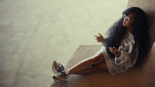 Behind H.E.R.'s